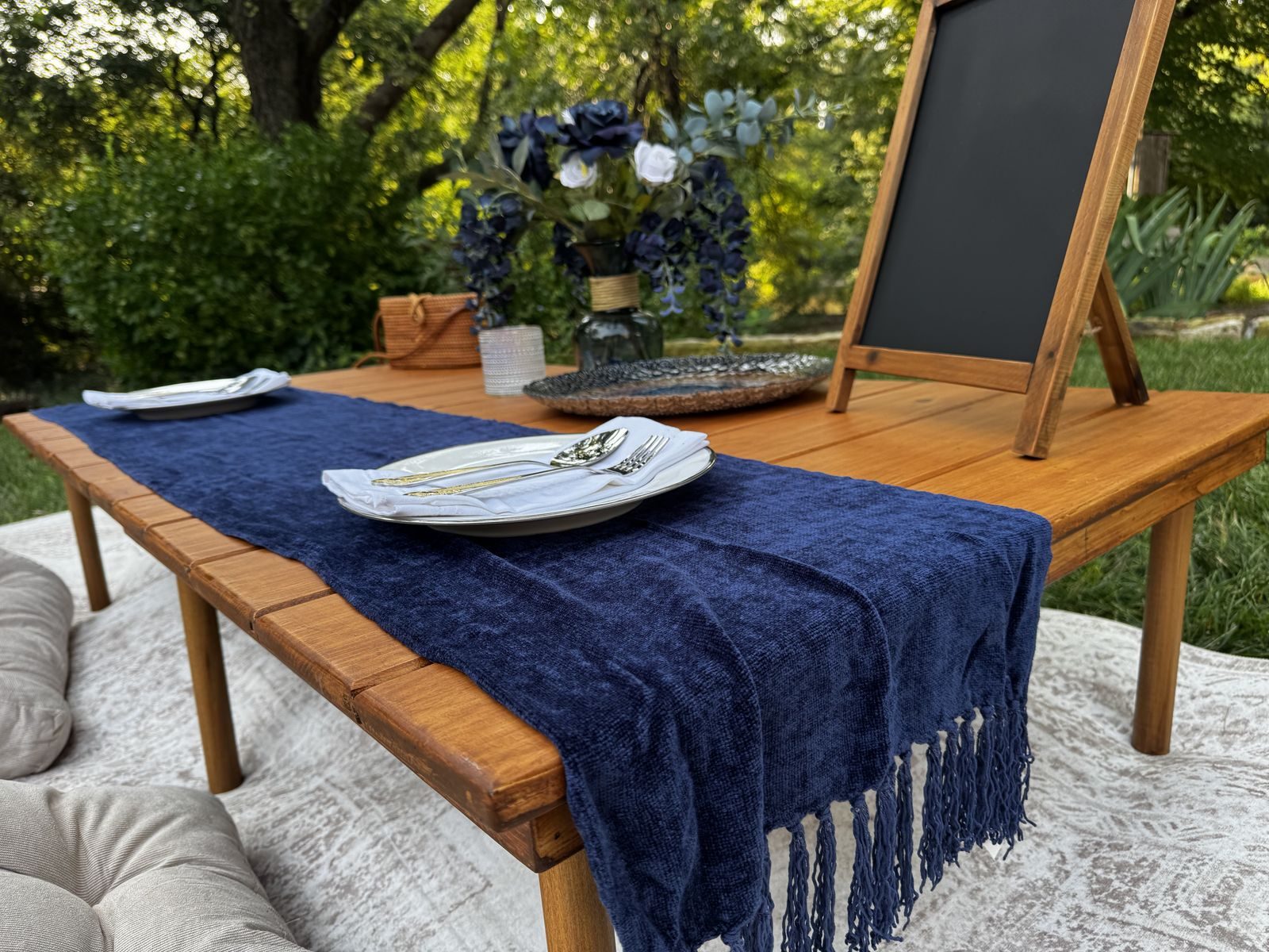 Midnight Garden. Navy, silver and natural wood, shot in daylight.